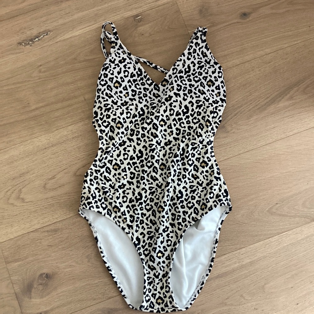Women’s black and white leopard/cheetah print one piece bathing suit.